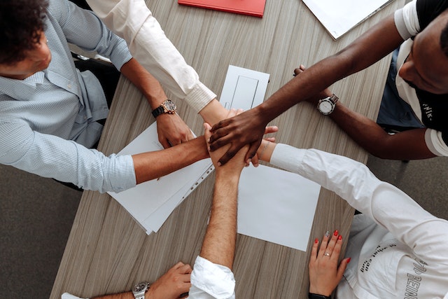 business%20team%20joining%20hands